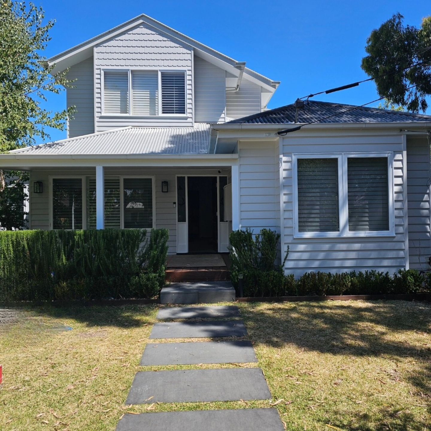 2-storey-white-weathboard-house