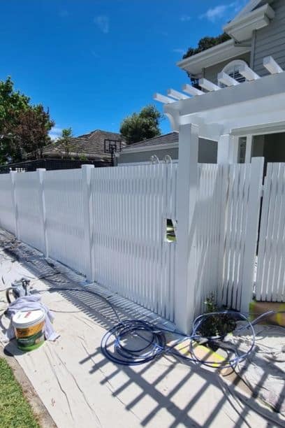 fence and airless spraying with white picket fence